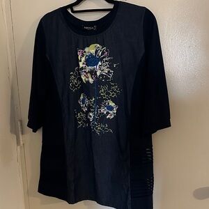 Esperanse Paris Tunic with vibrant floral print and sheer side panels.